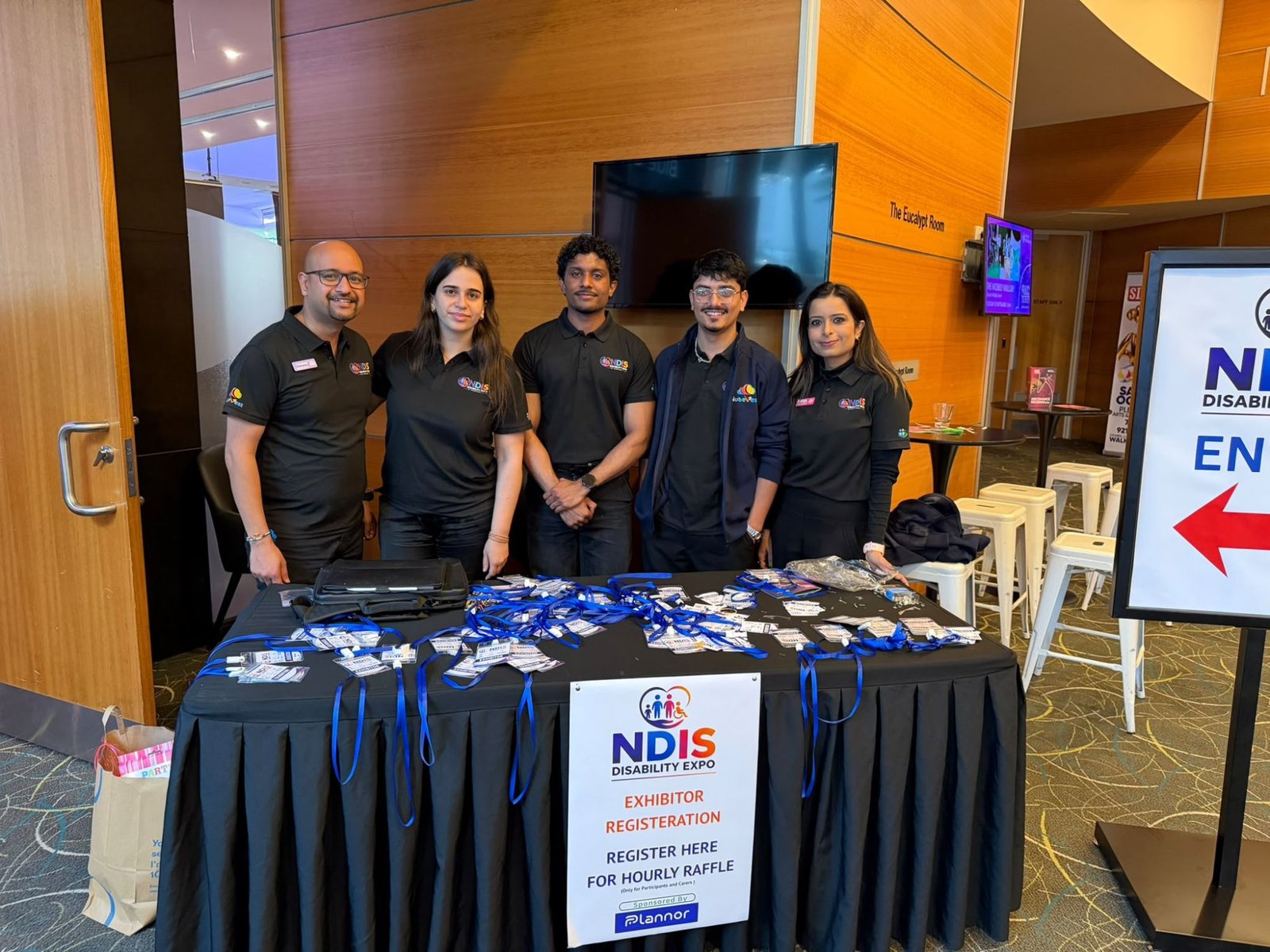 Nubevest team welcoming visitors at the exhibitor registration desk