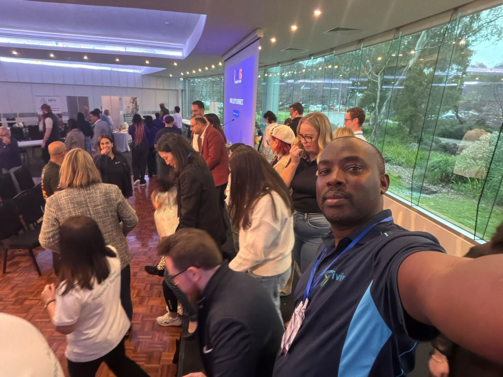 Busy expo floor with attendees moving between stalls